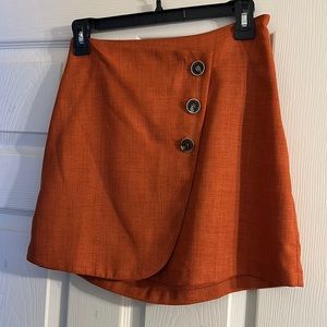 Burnt orange button mini skirt